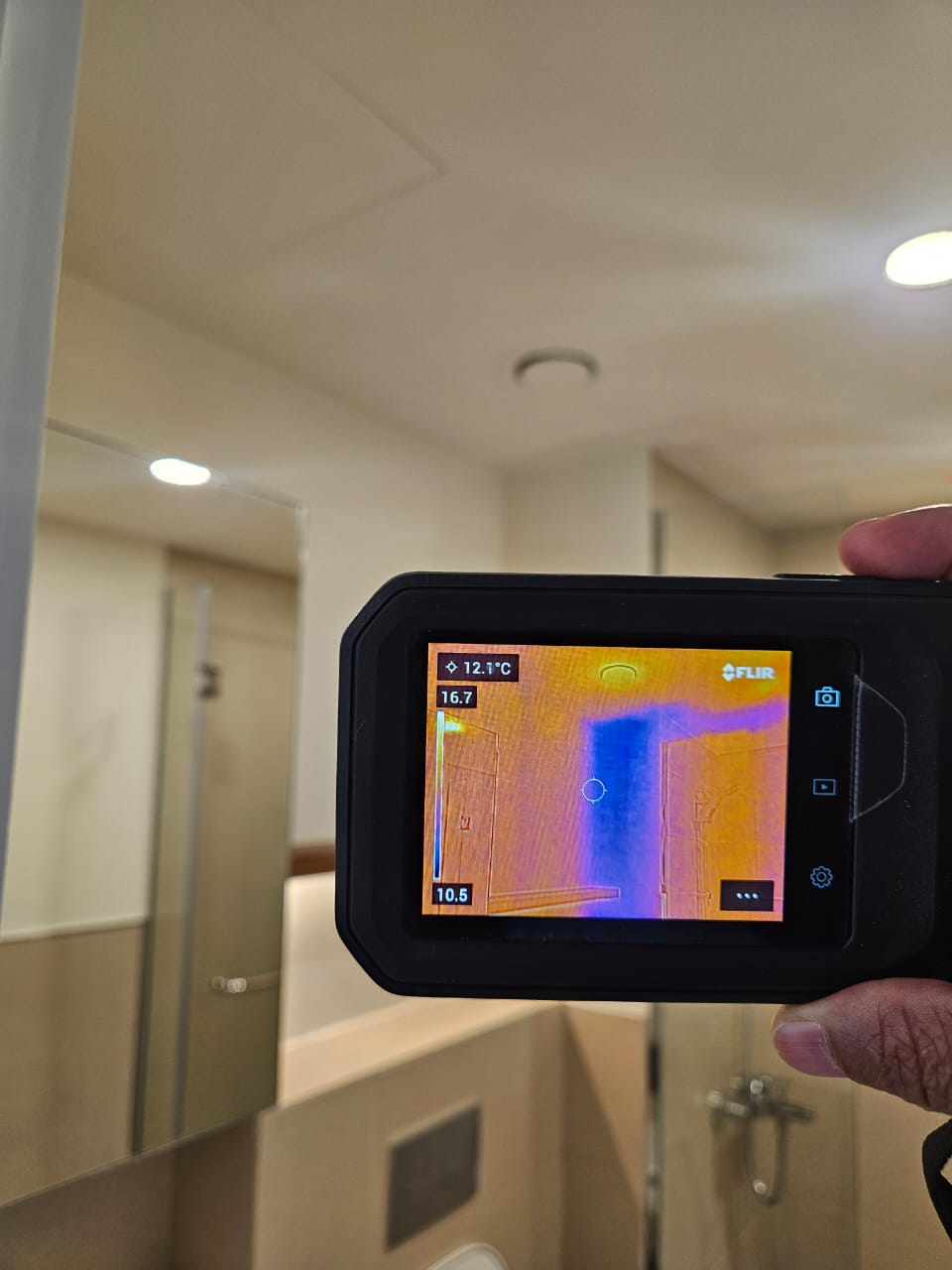 Abu Dhabi building quality inspection — engineer using infrared thermal imaging during property snagging